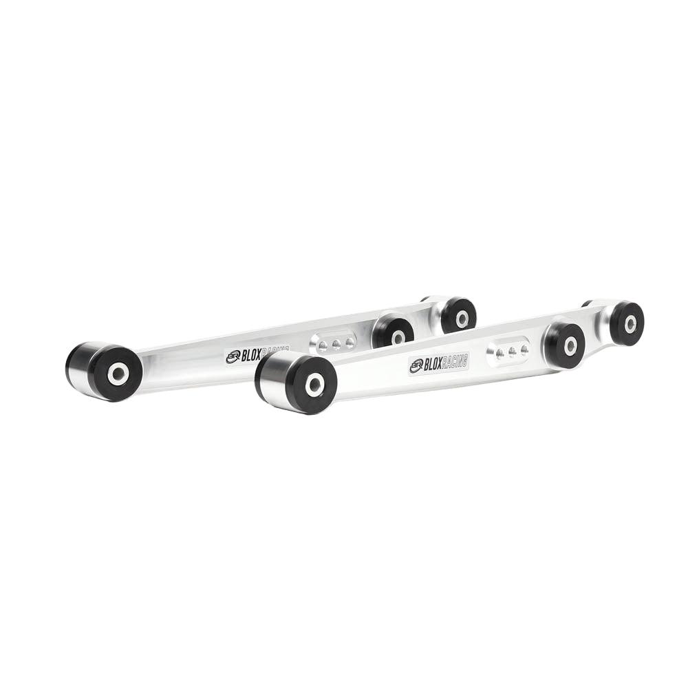 BLOX Racing performance rear lower control arms made from silver billet aluminum, with black bushings installed for a suspension upgrade.